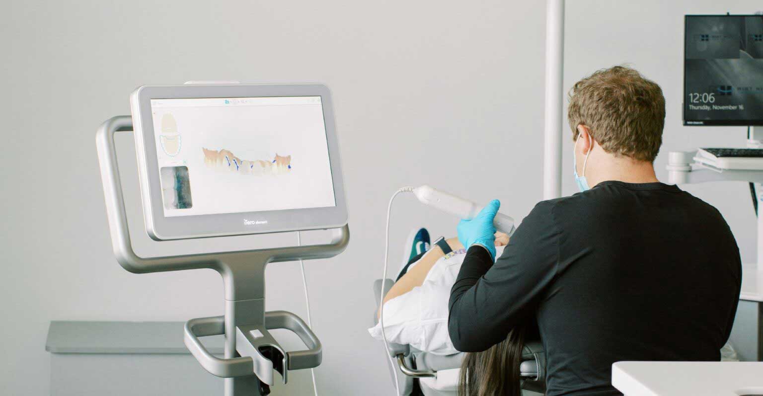 Dr. Jared examining a patient's teeth