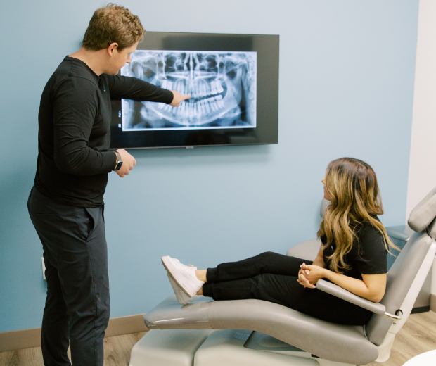 Dr. Jared showing a patient their X-rays