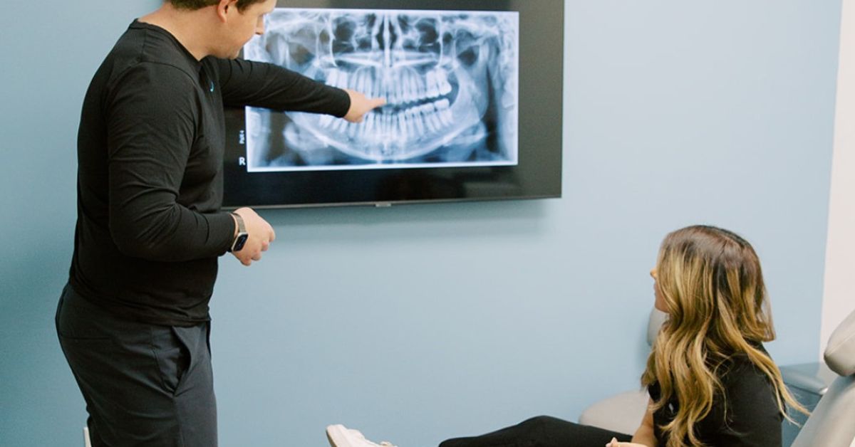 Dr. Jared showing a patient their X-rays