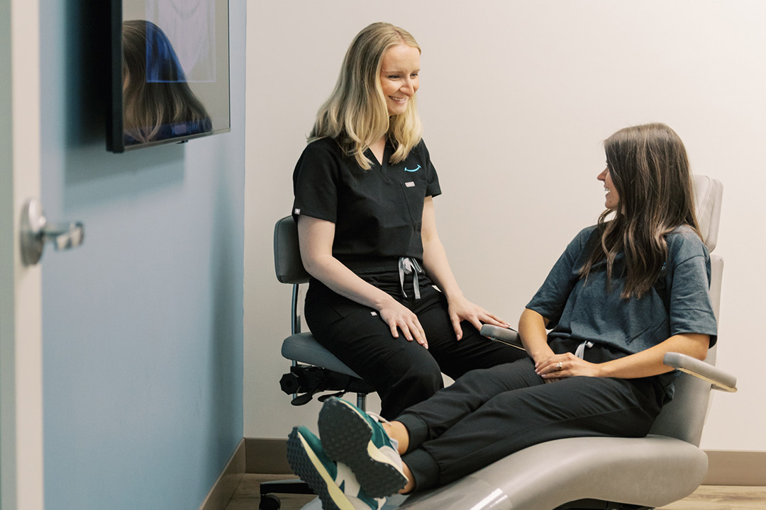 Dr. Rainey with patient in chair