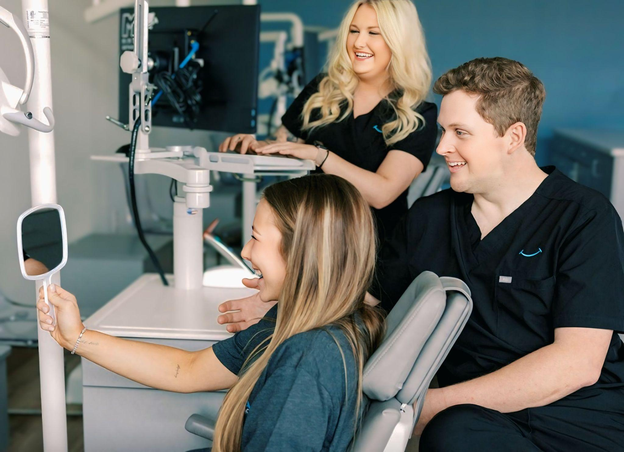 Patient smiling confidently after getting dental braces